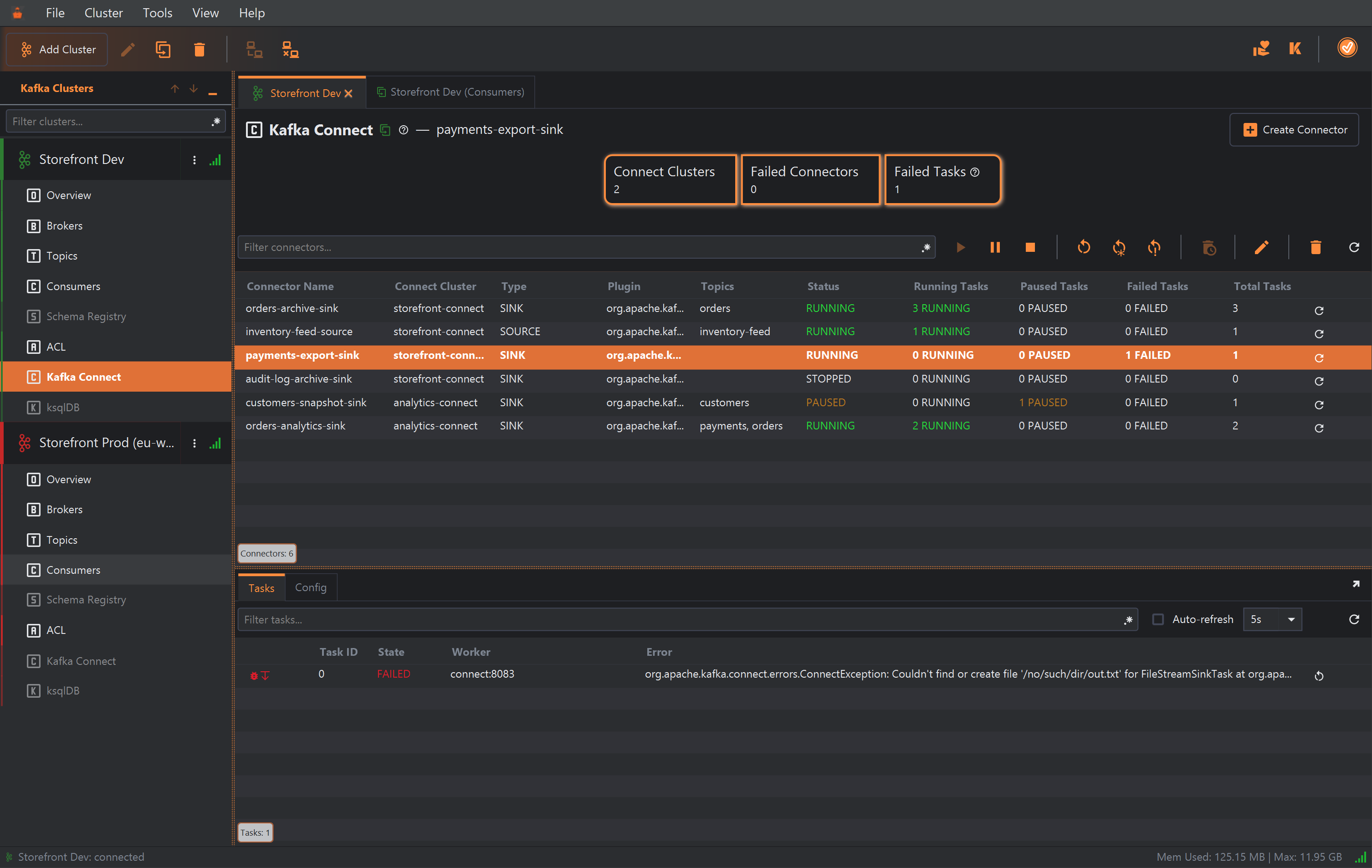 The Kafka Connect section of the Storefront Dev cluster, beside a duplicated Storefront Dev (Consumers) tab. The header reads Kafka Connect — payments-export-sink, with a Create Connector button on the right. Cards show Connect Clusters 2, Failed Connectors 0 and Failed Tasks 1. Under a Filter connectors field and a row of connector buttons, the table lists six connectors with their Connect cluster, type, plugin, topics, status and task counts: orders-archive-sink (storefront-connect, SINK, orders, RUNNING, 3 running tasks), inventory-feed-source (storefront-connect, SOURCE, inventory-feed, RUNNING, 1 running), payments-export-sink (storefront-connect, SINK, RUNNING, 1 failed task, selected), audit-log-archive-sink (storefront-connect, SINK, STOPPED, 0 tasks), customers-snapshot-sink (analytics-connect, SINK, customers, PAUSED, 1 paused task) and orders-analytics-sink (analytics-connect, SINK, payments and orders, RUNNING, 2 running). Below, the Tasks tab shows task 0 of payments-export-sink as FAILED on worker connect:8083 with a ConnectException: Couldn't find or create file '/no/such/dir/out.txt'.