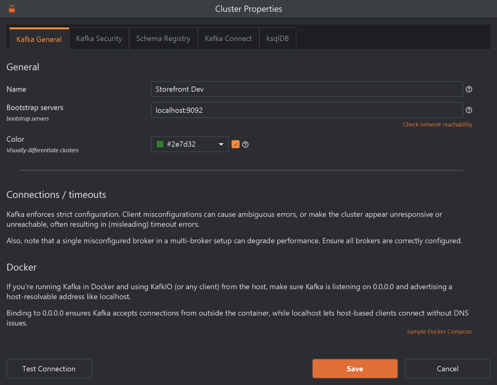 The Cluster Properties dialog on its Kafka General tab, with tabs for Kafka Security, Schema Registry, Kafka Connect and ksqlDB beside it. Name is Storefront Dev, Bootstrap servers is localhost:9092 and Color is ticked and set to green. Below are notes on connection timeouts and Docker with a Sample Docker Compose link, and at the bottom the Test Connection, Save and Cancel buttons.